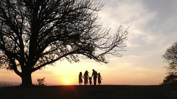 Family walking on a hill