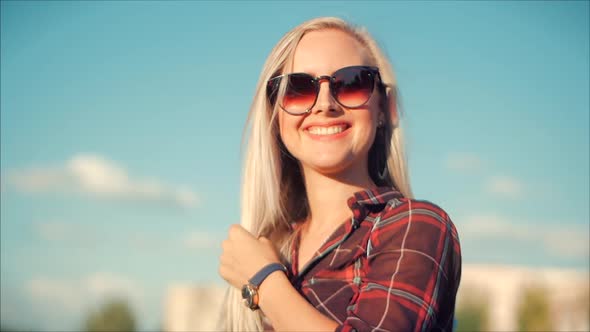 Close-Up Portrait of European Beautiful Cute Blonde in with Sunglass Young Woman or Cheerful Girl