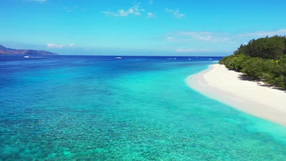 Aerial view sky of tropical coast beach holiday by turquoise sea with white sandy background of a da