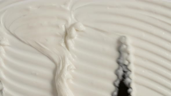 Motion of the Liquid Cream White Cosmetic Texture