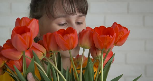 Happy teenage girl with flowers.