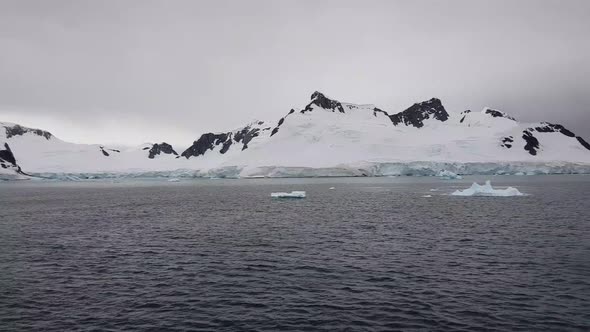 Travel on deep pure waters among glaciers of Antarctica. Fantastic snow landscapes.