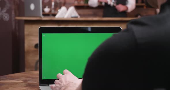 Close Up Shot Businessman Typing Fast on a Computer with Green Screen