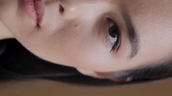 Vertical View Asian Korean Girl Sad Woman Half Human Female Face with Dark Eyes Natural Makeup