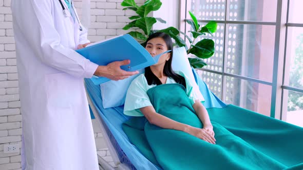 Doctor in Professional Uniform Examining Patient at Hospital