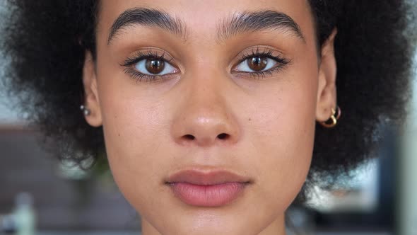 Face Closeup Portrait of a Darkhaired Mixed Race African American Ethnicity Young Woman Looking at
