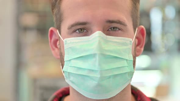 Close Up of Young Man with Protective Face Mask