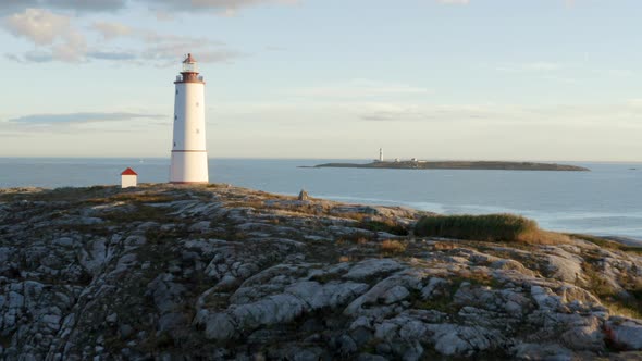 Aerial View Of Lille Torungen Lighthouse And Store Torungen Lighthouse In Arendal, Norway - drone sh