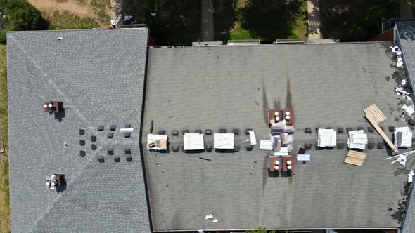 Roof Repairs Old Roof Replacement with New Shingles of an Apartment