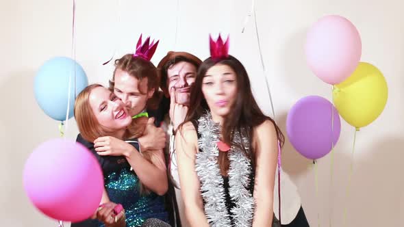 Funny crazy friends in photo booth