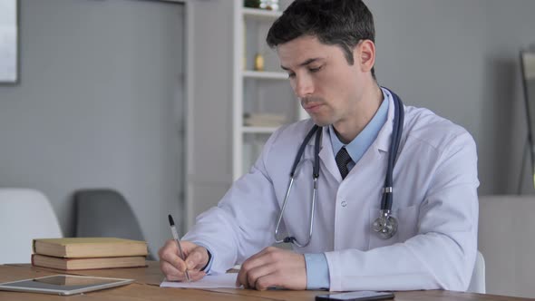 Doctor Writing  Medical Treatment for Patient