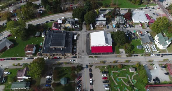 A steep tilt up view looking down on the small town of Ohiopyle, Pennsylvania in early autumn. The Y