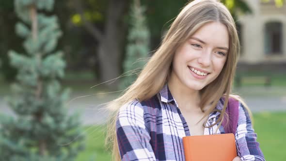 Pretty Young Woman Standing Near the University