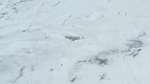 Aerial Drone View of Solheimasandur Dc3 Plane Crash in a Snowy Landscape in Iceland