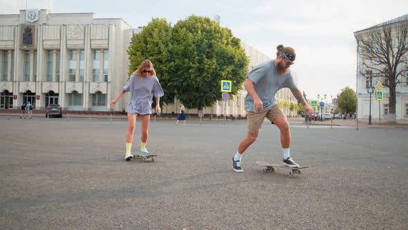 Beauty Boyfriend and Girlfriend Learn to Ride Longboard Together Tattoo Hands