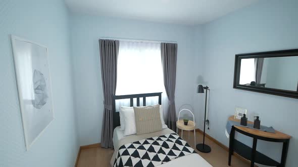 Cosy Black and White Bedrrom with Single Bed decorated with Stylish Furnitures