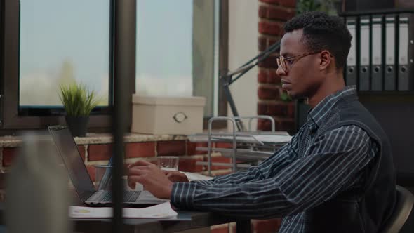 Accountant Typing on Laptop to Do Company Management Work