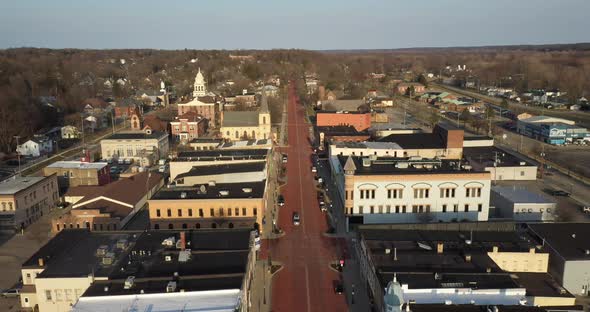 Downtown Ionia Michigan skyline with drone videoing forward.