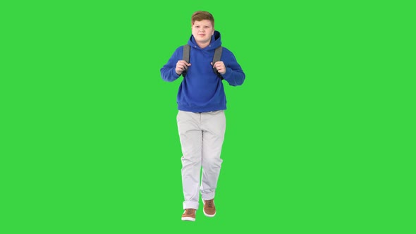 Male Student with a Backpack Walking on a Green Screen Chroma Key