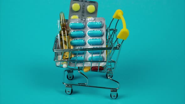 Shopping Cart Filled with Pills and Drugs. Buying a Pack of Pills. Stop Motion