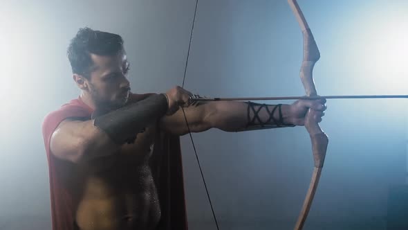 Shirtless Spartan Aiming with Arrow.