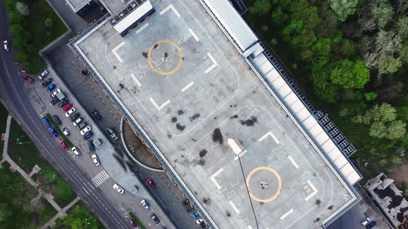 Aerial view above helipad. Drone Flight Over Rooftop Helipad.