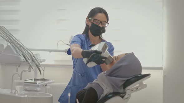 Dentist Working In Office