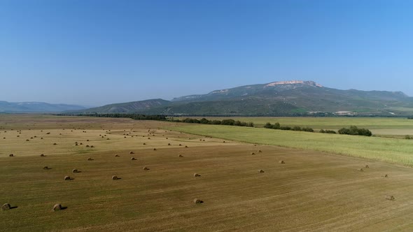 Aerial View Rural Field with Haystacks