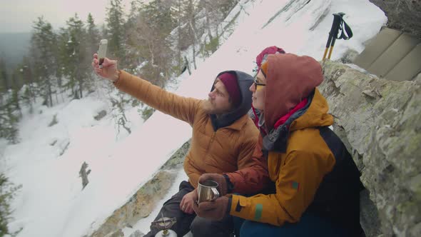 Couple Taking Selfie at Campsite in Mountains