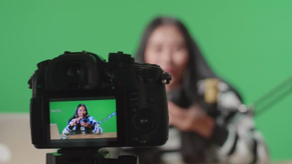 Close Up Of A Camera Monitor Recording Asian Woman Reviewing Camera Len On Green Screen