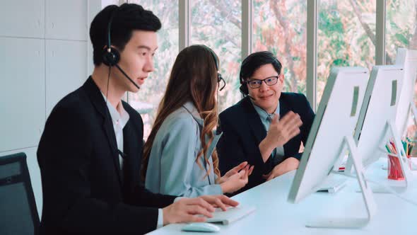 Business People Wearing Headset Working in Office