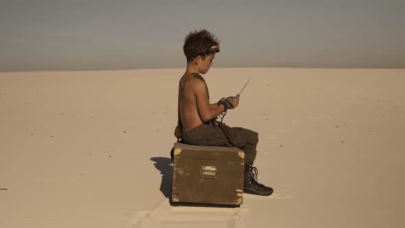 Postapocalyptic Warrior Boy Outdoors in Desert Wasteland