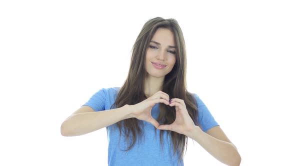 Handmade Heart Sign by Young Woman, White Background