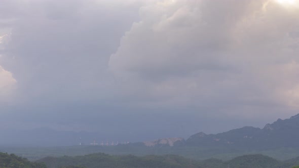 Rain storms and black clouds moving over the mountains.