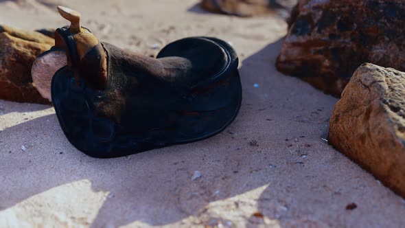 Old Horse Saddle on Sand Beach