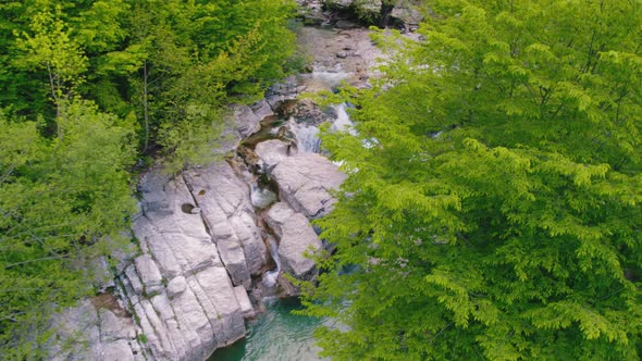 Beautiful Fresh Green Scenery with Mini Waterfall in Deep