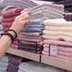 Male Hands Are Choosing a Towel in the Mall - VideoHive Item for Sale