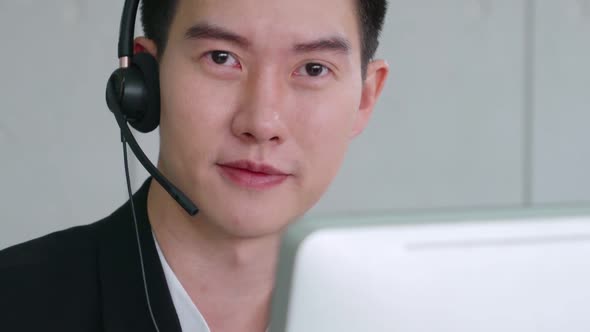 Business People Wearing Headset Working in Office