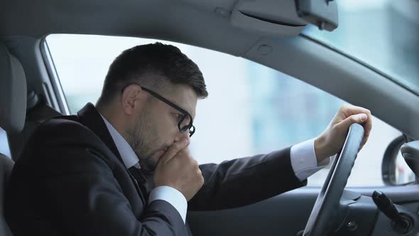 Male Driver Sneezing Sitting in Car on Parking Lot, Seasonal Allergy, Virus