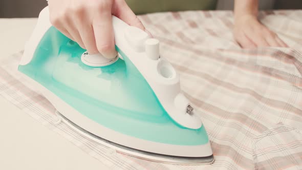 Female Hand Regulates the Ironing Temperature