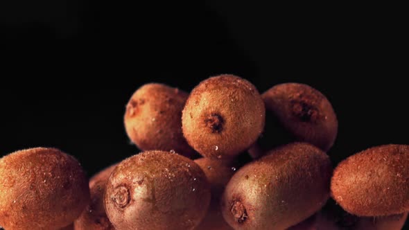 Super Slow Motion Whole Ripe Kiwis Toss Up