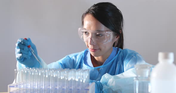 Woman scientist doing research in laboratory