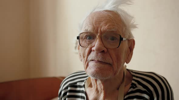 Senior Man Wrinkled Skin Face Looking at Camera Expressive Tense Look Portrait