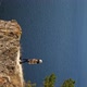 The Girl Comes to the Edge of the Cliff and Admires the Beautiful View - VideoHive Item for Sale