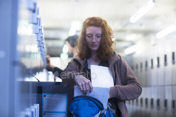 Student at locker room in library