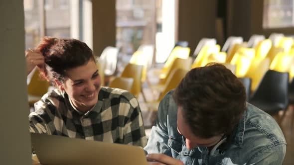 Couple of Two Young People are Laughing Together While Discussing Something