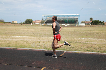 The Runner Sprint In The Athletic Track