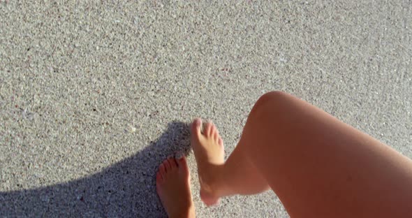 Woman walking at beach in the sunshine 4k