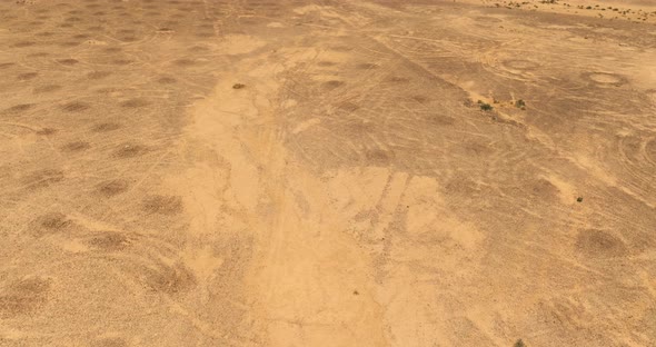 Dry Desert landscape, low pass aerial view.