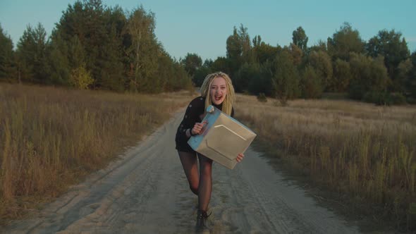 Spooky Vampire with Jerrycan Walking on Dirt Road